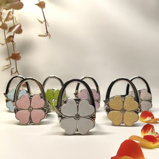 Add a chic touch to your bag with the stylish Foldable Handbag Hanger.