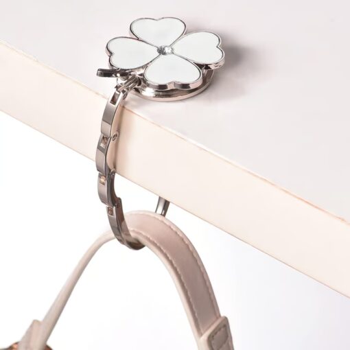 Keep your bag safe and secure with the Foldable Handbag Hanger.