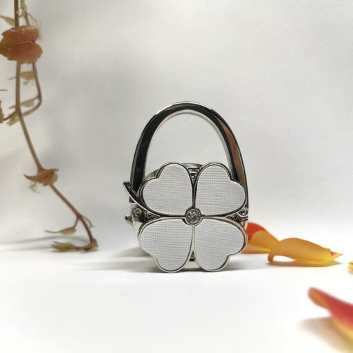 Keep your purse safe and close with the Foldable Handbag Hanger.