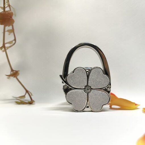 Lightweight and practical, the Foldable Handbag Hanger fits any handbag.