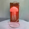 The mesmerizing motion of the jellyfish in the Jellyfish Table Lamp creates a peaceful atmosphere.