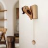 Nature-inspired Woodpecker Door Knocker with handcrafted wooden design.